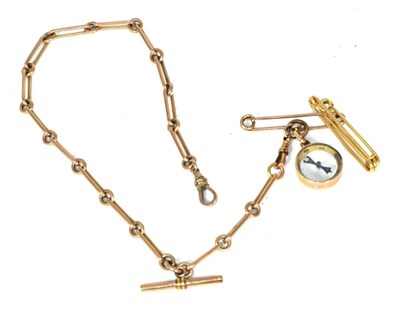 Lot 102 - A watch chain, chain links stamped 9ct and an attached compass with the side inscribed ";FR Duke of