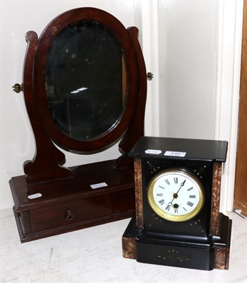 Lot 140 - A Victorian black slate mantel clock and a toilet mirror