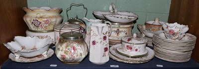 Lot 145 - Two shelves of Simon Fieldings Crown Devon pottery, including teapots, biscuit barrels etc