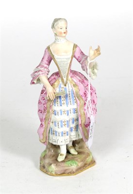 Lot 150 - A Meissen porcelain figure of a lady, late 19th century, standing wearing a lace trimmed dress...