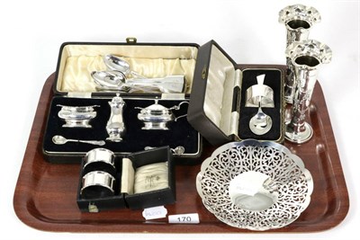 Lot 170 - A group of silver comprising: cased three piece condiment, cased pair of napkin rings, cased...