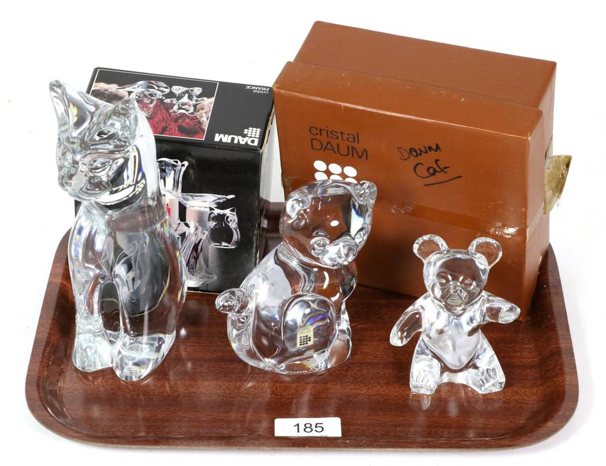 Lot 185 - Two Daum glass models of cats; and another of a teddy bear, the largest 19cm high (3)