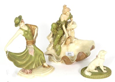 Lot 211 - A Royal Dux model of a flamenco dancer; another model of a girl at a well with shell form bowl; and
