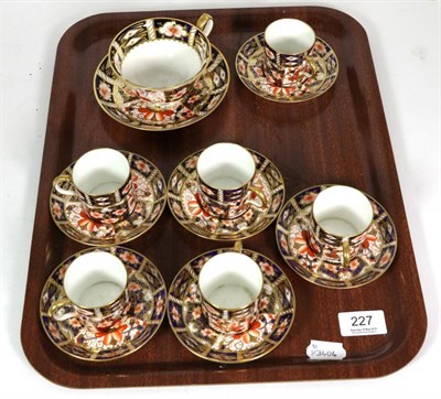 Lot 227 - A set of six Royal Crown Derby Imari coffee cans and saucers, pattern 2451, and a matching tea...