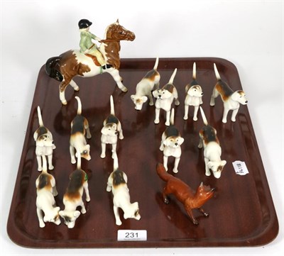 Lot 231 - Beswick Girl on Pony, model No. 1499, Skewbald gloss; together with twelve Fox Hounds and a Fox...