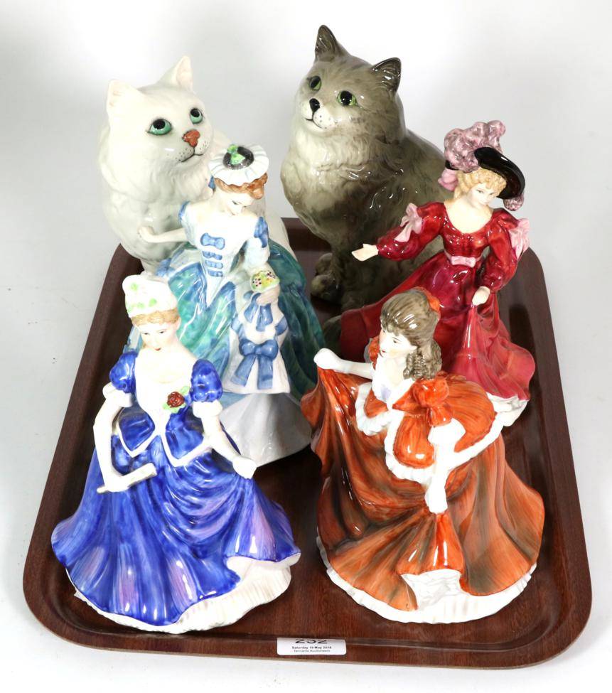 Lot 232 - Four Royal Doulton figures and two Beswick cats