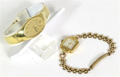 Lot 245 - A Tissot 18 carat gold wristwatch with integral bracelet and documentation; together with a Cyma 18