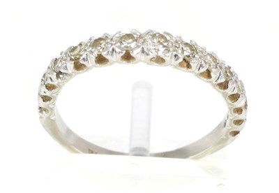 Lot 248 - A diamond half hoop ring, graduated round brilliant cut and eight-cut diamonds in claw...