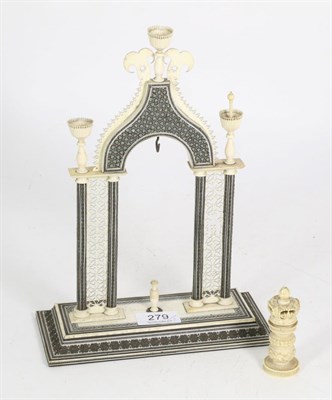 Lot 279 - An Indian ivory and sadeli watch holder and ivory chess piece, 19th Century