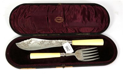 Lot 286 - A pair of Victorian silver fish servers with ivory handles, Sheffield, 1894, in fitted case