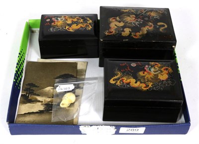 Lot 289 - A Japanese carved ivory skull, late 19th century; a set of lacquer boxes; and two early 20th...