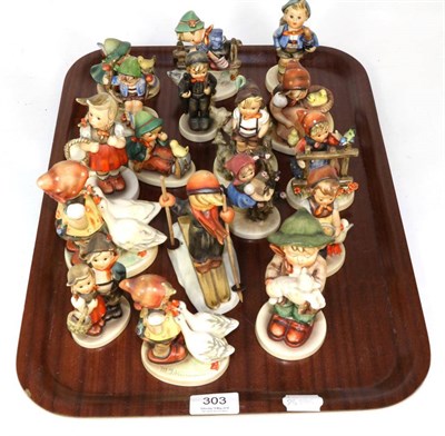 Lot 303 - A collection of seventeen Goebel Hummel figures including a model skiing