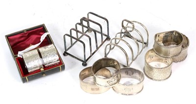 Lot 331 - Two silver toast racks, a pair of silver cased napkin rings and six other silver napkin rings