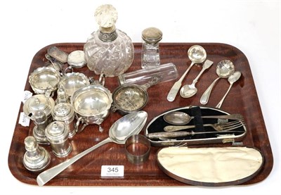 Lot 345 - A group of assorted silver items to include: a group of various condiments; a tea strainer;...