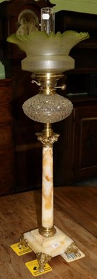 Lot 360 - A brass and onyx Corinthian column oil lamp, with green tinted and etched shade, clear glass...