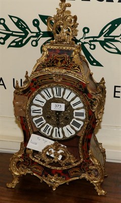 Lot 373 - A reproduction boulle type striking mantel clock
