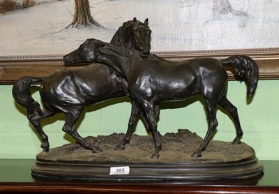 Lot 385 - A patinated resin group of a pair of horses after the model by Pierre Jules Mene