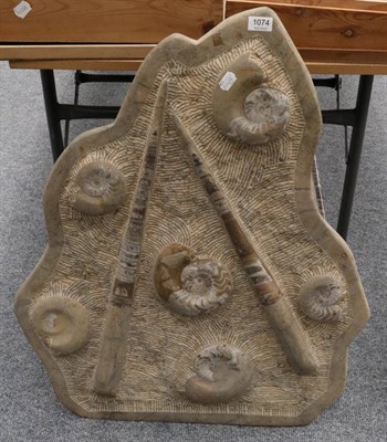 Lot 1074 - Fossils: Two Orthoceras and Six Ammonites from the Atlas Mountains, Morocco, encased within a large