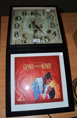 Lot 1159 - A wall timepiece with glazed aperture with poster marked 'Gone with the Wind'