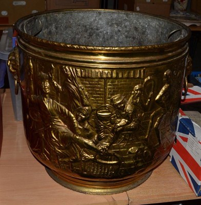 Lot 1170 - A large copper coal bin decorated in relief with figures in a tavern interior