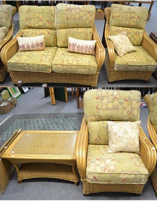 Lot 1184 - A two seater wicker type settee together with two matching armchairs and a coffee table