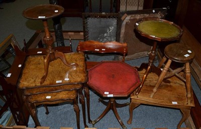 Lot 1189 - A nest of three walnut veneered tables; four small occasional tables; three small wall racks; a...