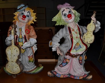 Lot 1192 - A pair of Continental ceramic clown figures of large proportions, 82cm in height (2)