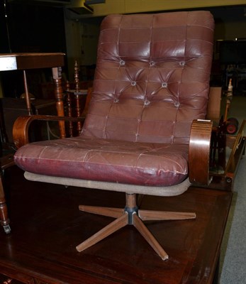 Lot 1194 - A retro leather swivel chair