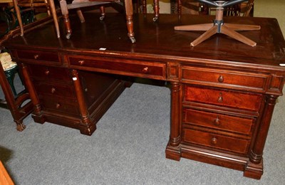 Lot 1195 - A mahogany twin pedestal desk, six short over one long drawer