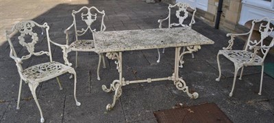 Lot 1313 - A modern garden white painted metal table and chairs