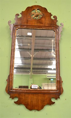 Lot 1324 - An 18th century fret carved wall mirror with a gilt Eagle roundel