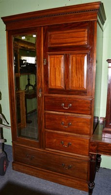 Lot 1328 - A mahogany wardrobe with mirrored door