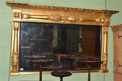 Lot 1330 - A Regency gilt and gesso overmantel mirror, early 19th century, of breakfront form with a...