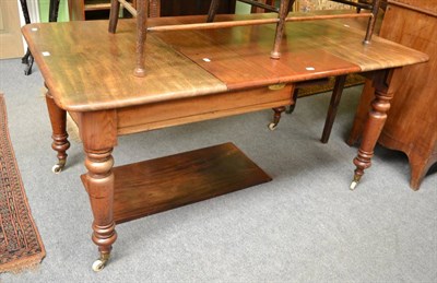 Lot 1337 - A Victorian mahogany extending dining table on turned supports and castors