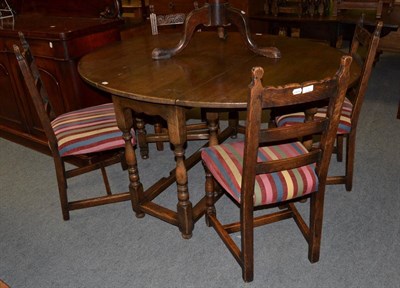 Lot 1346 - A Titchmarsh & Goodwin oak gateleg table and four chairs