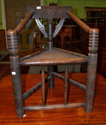 Lot 1349 - A 19th century oak turner's chair, of typical construction with carved top rail and bobbin...