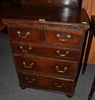 Lot 1351 - An oak small four height chest of drawers