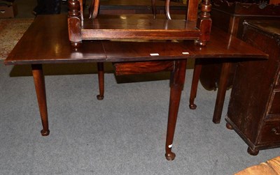 Lot 1353 - A George III rectangular mahogany drop leaf table