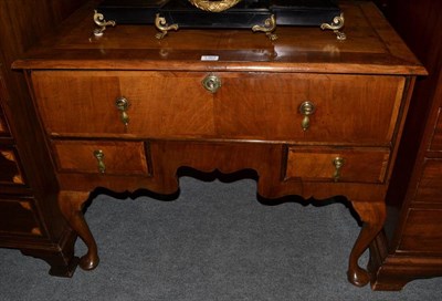 Lot 1362 - An 18th century walnut, featherbanded and crossbanded kneehole desk or dressing table, the top...