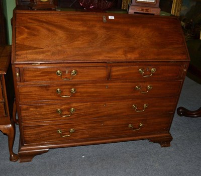 Lot 1363 - A George III mahogany bureau on ogee bracket feet