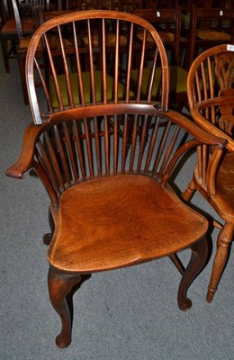 Lot 1366 - A George III spindle back Windsor armchair on cabriole supports with pad feet