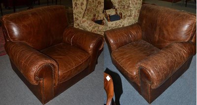 Lot 1372 - A pair of leather upholstered lounge armchairs