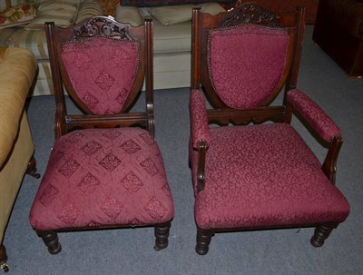 Lot 1379 - A pair of late Victorian walnut framed armchairs