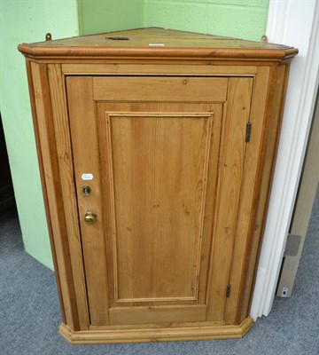 Lot 1413 - A pine corner cupboard