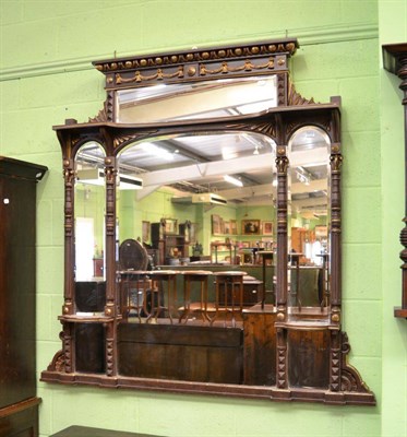 Lot 1415 - A simulated rosewood and gilt decorated overmantel mirror with an egg and dart moulded cornice,...