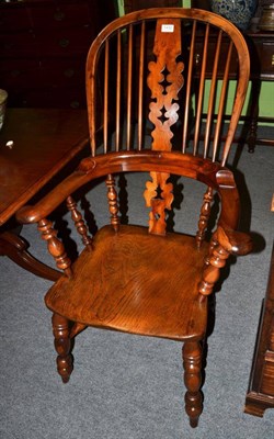 Lot 1432 - A 19th century yew wood Windsor armchair