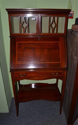 Lot 1434 - A small Edwardian line inlaid and checker banded bureau with glazed upper section