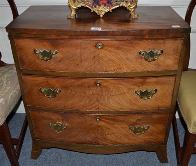 Lot 1443 - A small 19th century mahogany bow front chest of drawers fitted with three long drawers