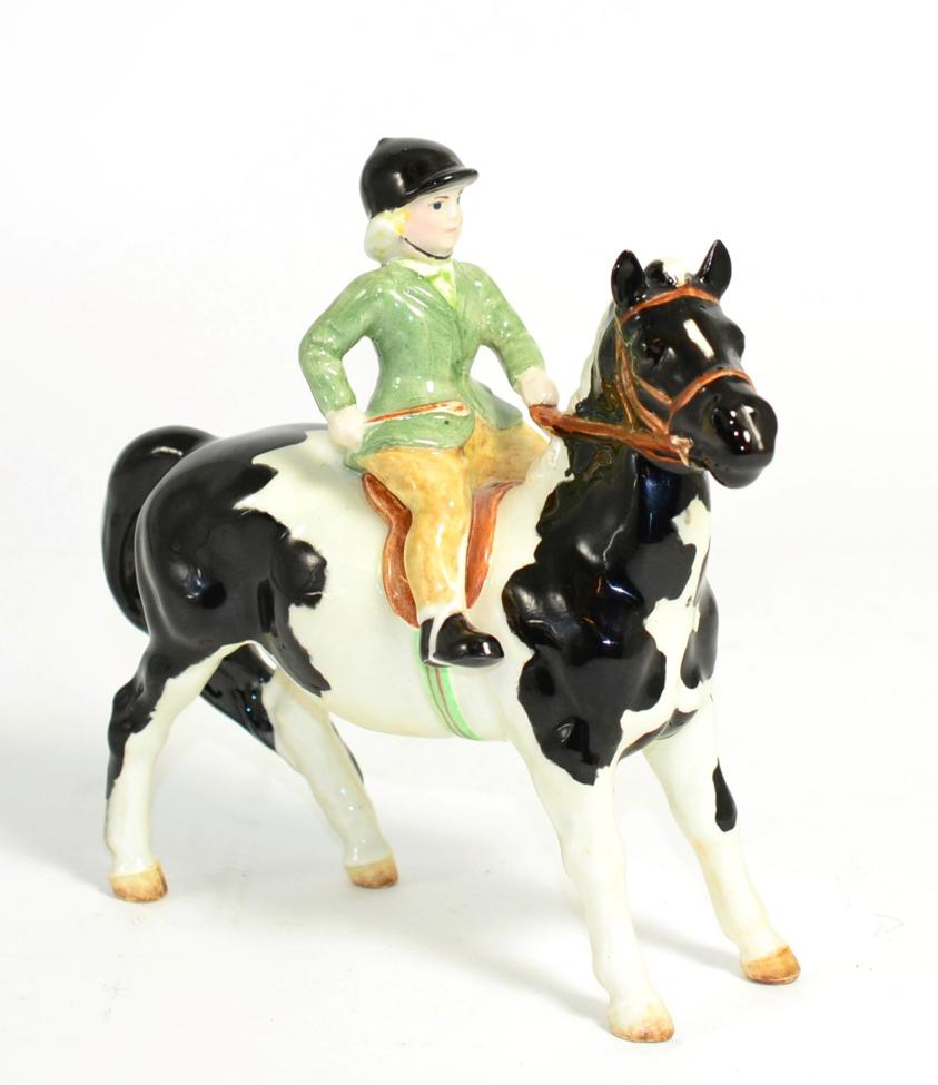Lot 111 - Beswick Girl on Pony, model No. 1499, Piebald gloss