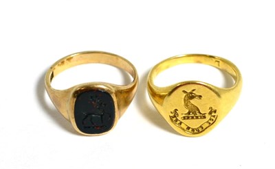 Lot 166 - A bloodstone set ingalio signet ring, an oval bloodstone engraved with a stag with a raised...